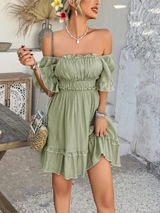 Detail of olive green off-shoulder dress with ruffled sleeves and tiered skirt hem