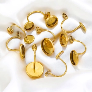 Golden stainless steel earring posts with round base trays and butterfly backs