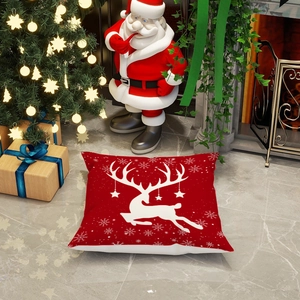 Christmas red throw pillow cover featuring white reindeer silhouette and snowflakes
