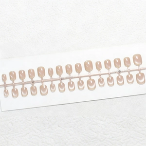 Short nude pink cat-eye press-on nails set with 24 pieces in various sizes for a glossy finish