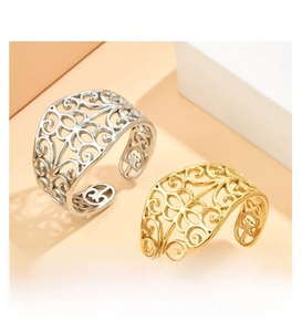 Detail of vintage filigree hollow pattern rings in gold and silver stainless steel
