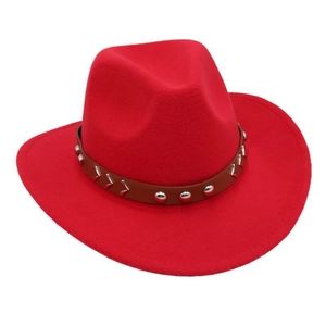 Detail of red wool felt cowboy hat featuring brown leather band with silver metal rivets