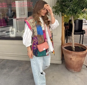 Detailed street style view of sleeveless bohemian patchwork quilted vest for women