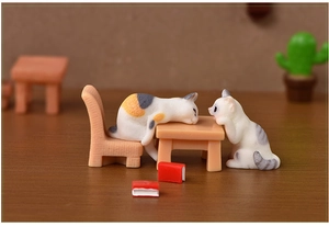 Miniature resin cat figurines with tiny table, chair, and books for micro landscape