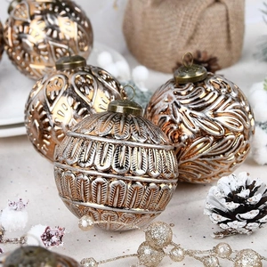 Detailed view of 8cm bronze Christmas balls with vintage patterns and leaf textures