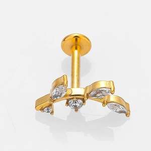 Macro shot of gold stainless steel labret stud with five sparkling marquise zirconias