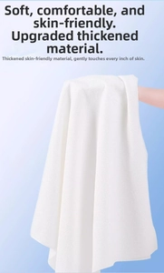 Detailed view of white honeycomb texture on thickened disposable cotton towel