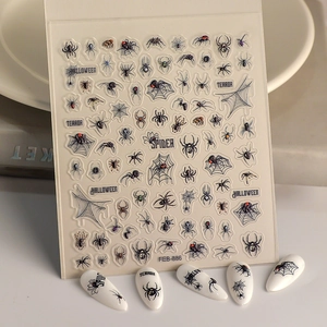 Macro view of Halloween spider web nail stickers with 3D embossed gothic spider designs
