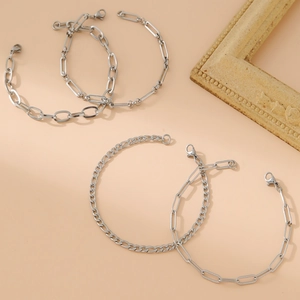 Set of four silver minimalist stainless steel bracelets with paperclip and curb chains