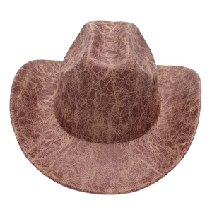 Close-up of vintage Western cowboy hat with distressed brown texture and pinched crown