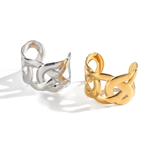 Polished hollow-out chain link cuff bracelets in gold and silver finish on white background
