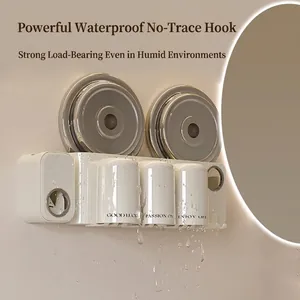 Creamy white wall-mounted toothbrush holder set with automatic toothpaste dispenser