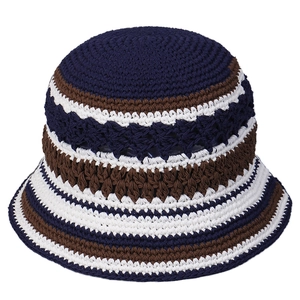 Handmade crochet bucket hat with hollow-out knit pattern in navy blue and tan stripes