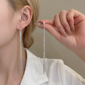 Elegant long silver tassel earrings with sparkling rhinestones for a minimalist luxury look