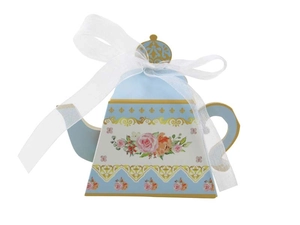 Detail of teapot-shaped candy box in light blue with gold lace and pink floral pattern