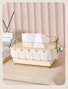 Detail of luxury tissue box with amber casing and wavy texture in a cozy home setting