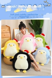 Adorably soft colorful penguin plush toys wearing red Santa hats for Christmas gift decoration
