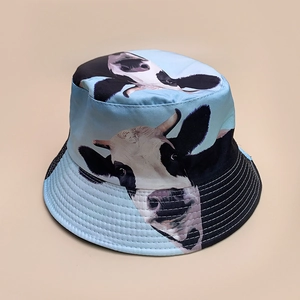Close-up of sky blue fisherman hat featuring realistic cow prints and durable fabric