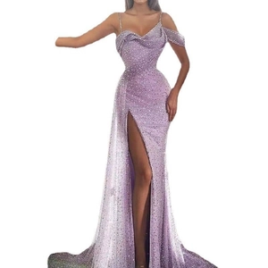 Detail of purple sequin evening dress featuring high slit and shimmering fabric finish