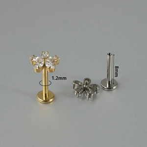 Titanium daisy flower labret stud with zircon stones in gold and silver finish