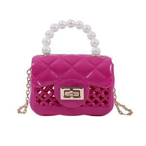Mini rose pink jelly crossbody bag with pearl handle and hollowed lattice design