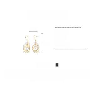 Detail view of layered geometric copper earrings with dimensions of 3cm by 8cm