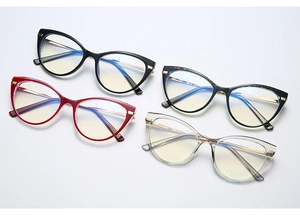 Flat lay of cat-eye anti-blue light glasses in black, tortoiseshell, red and clear frames