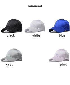 Matrix display showing baseball caps in black, white, blue, grey, and pink colors