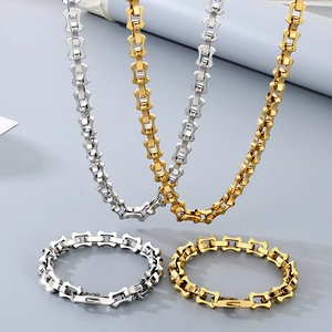 Polished titanium steel jewelry set featuring silver and gold chain necklaces and bracelets