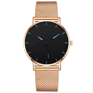 Detail of rose gold mesh band watch with black dial and blue hour markers