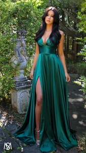 Detail view of dark green satin dress featuring a deep V-neck and elegant side slit