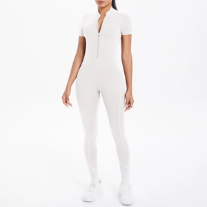 Detail of slim fit yoga jumpsuit with half-zipper and short sleeves in light grey