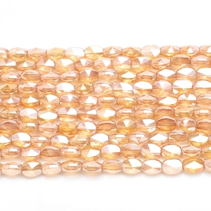 Close-up of gold-edged faceted glass crystal beads for DIY handmade jewelry crafts