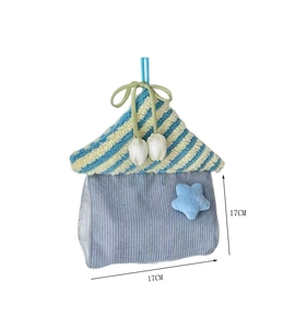 Detail view of the star house tissue holder with 17cm dimensions and hanging ribbon