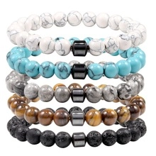 Detail of 5-piece stretch bracelet set with tiger eye, turquoise and lava rock beads