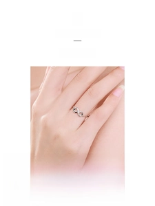 Close-up of adjustable sterling silver infinity ring with sparkling micro-pave zircons