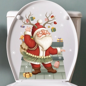 Christmas Santa Claus and reindeer decal applied on white bathroom toilet lid cover