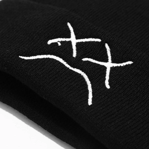Trendy black knit beanie with white XX embroidery featuring a street style winter design