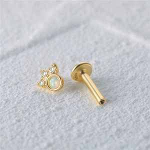 Macro view of S925 sterling silver opal stud earring with zircon accents and gold plating