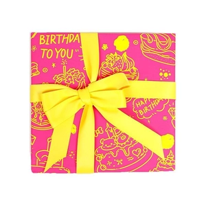Pink birthday gift wrapping paper roll with happy birthday text and yellow ribbon bow