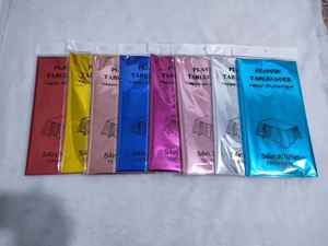 Multiple colors of disposable PET rose gold and colorful plastic tablecovers in packaging