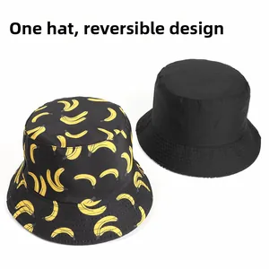 Detail of reversible sun hat with yellow banana print and solid black cotton fabric