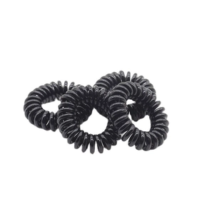 Detailed view of four high-elastic spiral telephone wire hair ties in glossy black finish