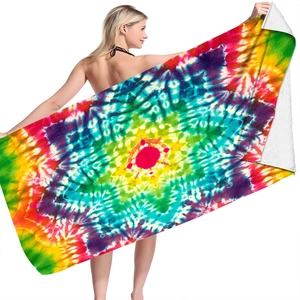 Macro detail of microfiber beach towel with vibrant 3D digital tie-dye mandala pattern