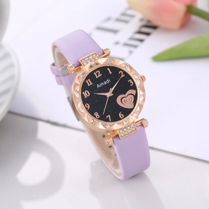 Macro detail of starry dial with heart pattern and rhinestone bezel on purple leather watch