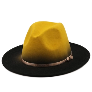 Detail of yellow and black gradient fedora with bronze metallic buckle hat band