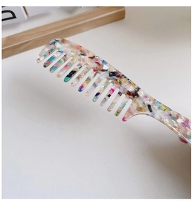 Detail of marble pattern acetate wide-tooth hair comb with anti-static colorful texture