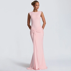 Detail of the pink sleeveless evening gown featuring a stylish waist knot and draped folds