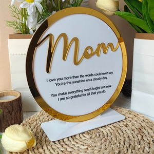 Macro view of acrylic heart ornament with gold mirror frame and Mom poem for Mother's Day