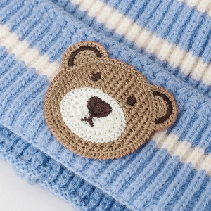 Winter blue striped knit earflap hat with cute brown crochet bear patch for babies